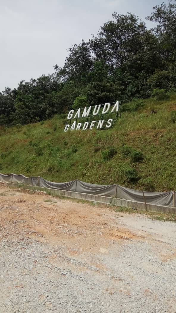 Gamuda Gardens hillside site during signage works